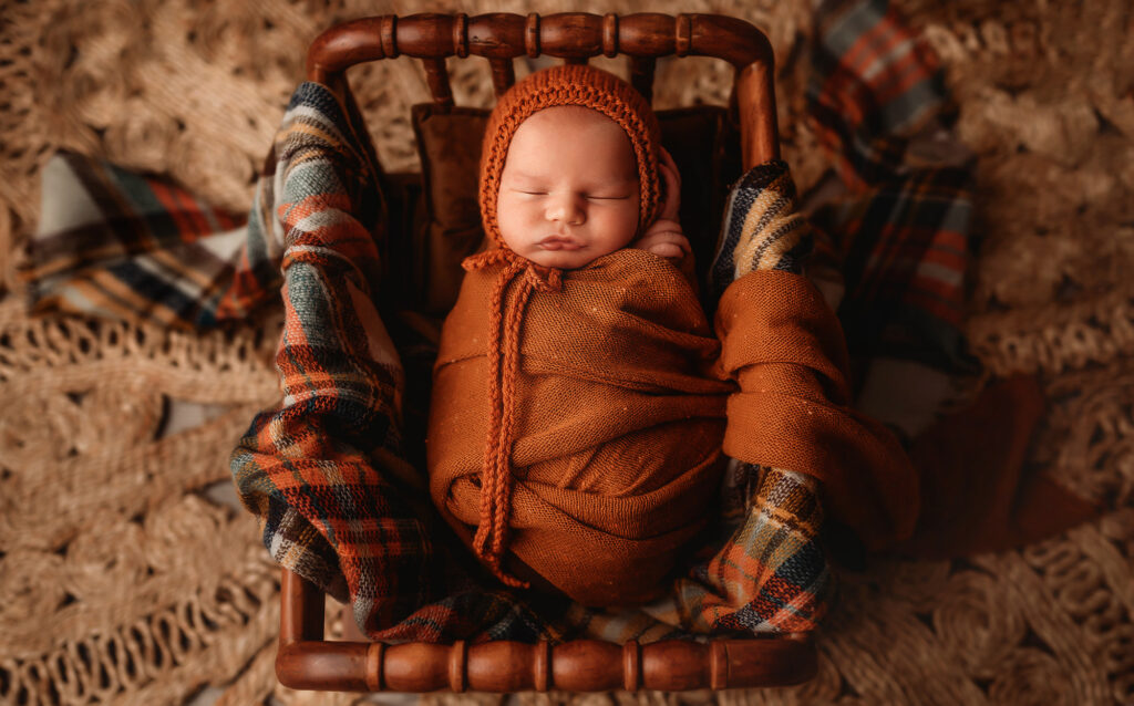 Infant poses for Newborn Photoshoot in Charleston, SC while his mother works with Lactation Consultants in Charleston, SC. 