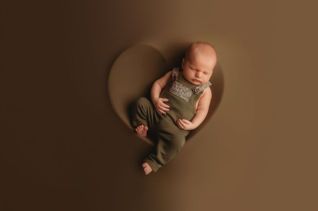 Infant posed for Newborn Photos in Charleston, SC while his mother works with Lactation Consultants in Charleston, SC. 