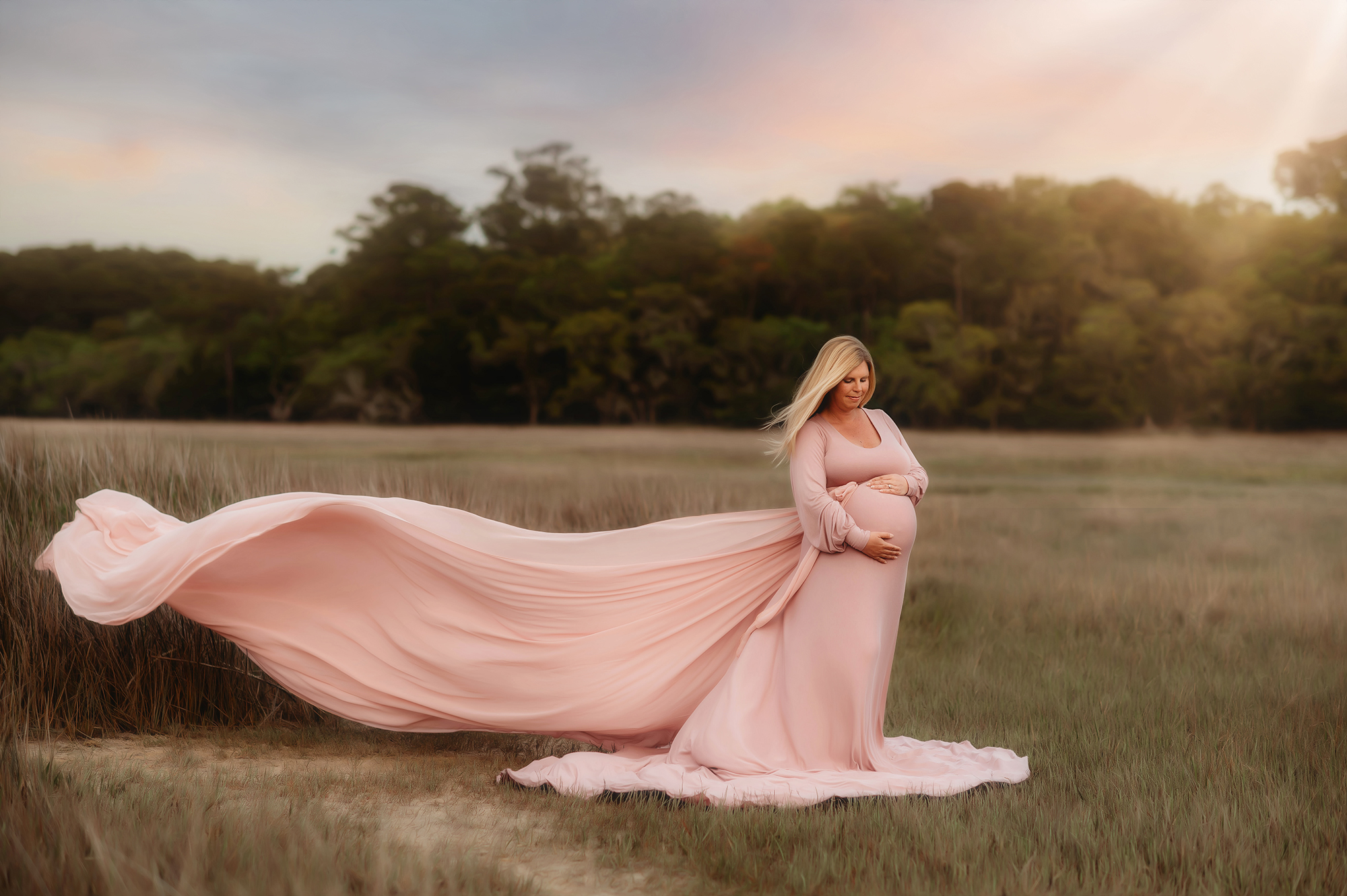 Expectant mother poses for Maternity Photoshoot in Charleston, SC after working with the Best Fertility Specialists in Charleston.