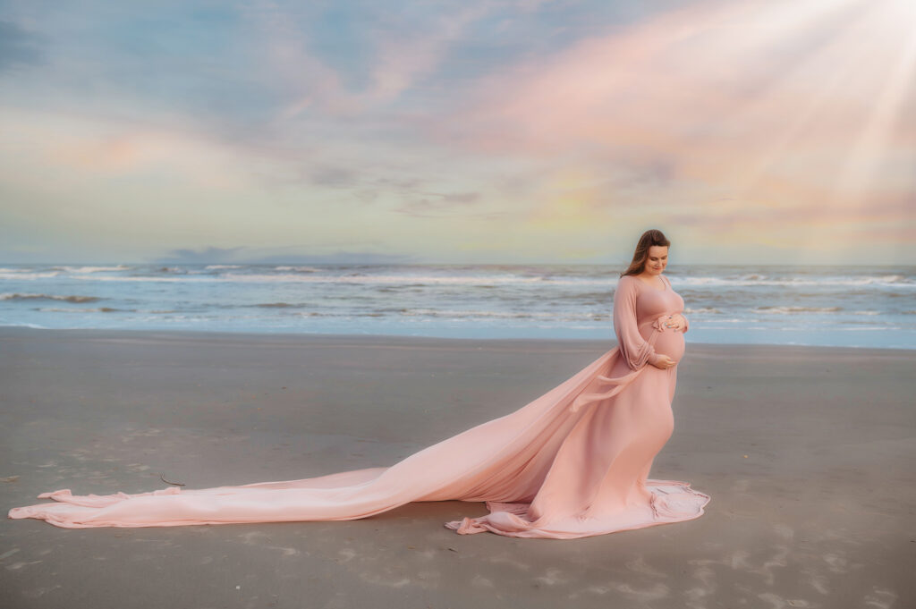 Expectant mother poses for Maternity Portraits on Folly Beach in Charleston, SC. 