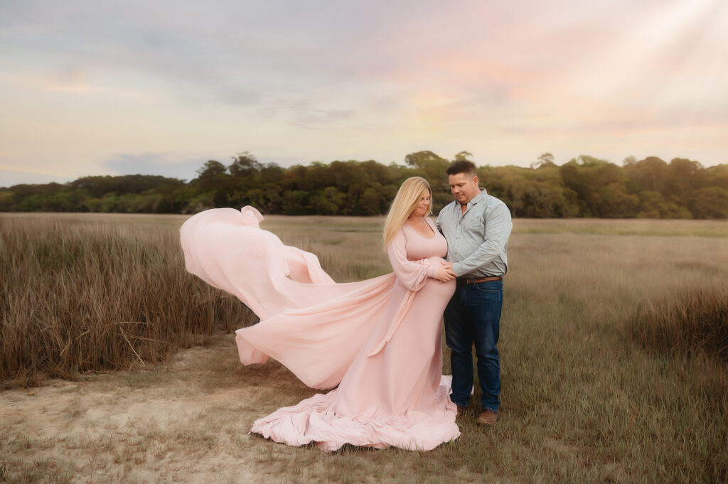 Expectant parents pose for Maternity Portraits in Charleston, South Carolina. 