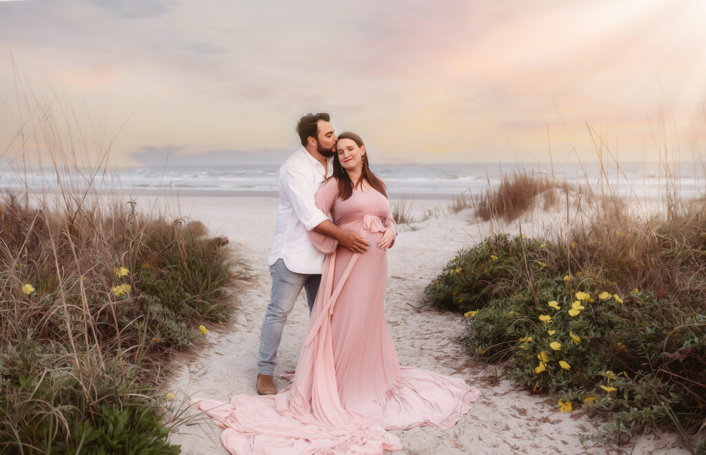 Expectant parents pose for Maternity Photoshoot on Folly Beach in Charleston, South Carolina after researching Top Ten Ideas for Planning your Babymoon in Charleston.