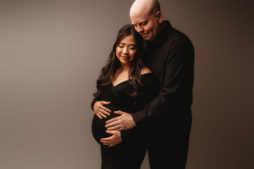 Expectant parents pose for Studio Maternity Portraits in Charleston, SC 