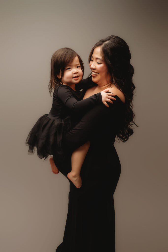 Expectant mother poses for Studio Maternity Portraits with ther toddler in Charleston, SC 