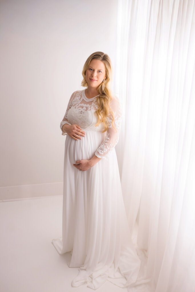 Expectant mother poses for Maternity Photos in Charleston Portrait Studio. 
