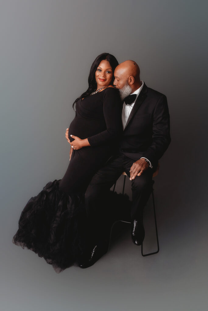 Expectant parents pose for Studio Maternity Portraits in Charleston, SC. 