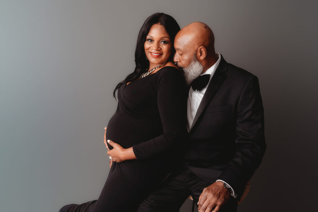 Expectant parents pose for Studio Maternity Portraits in Charleston, SC. 