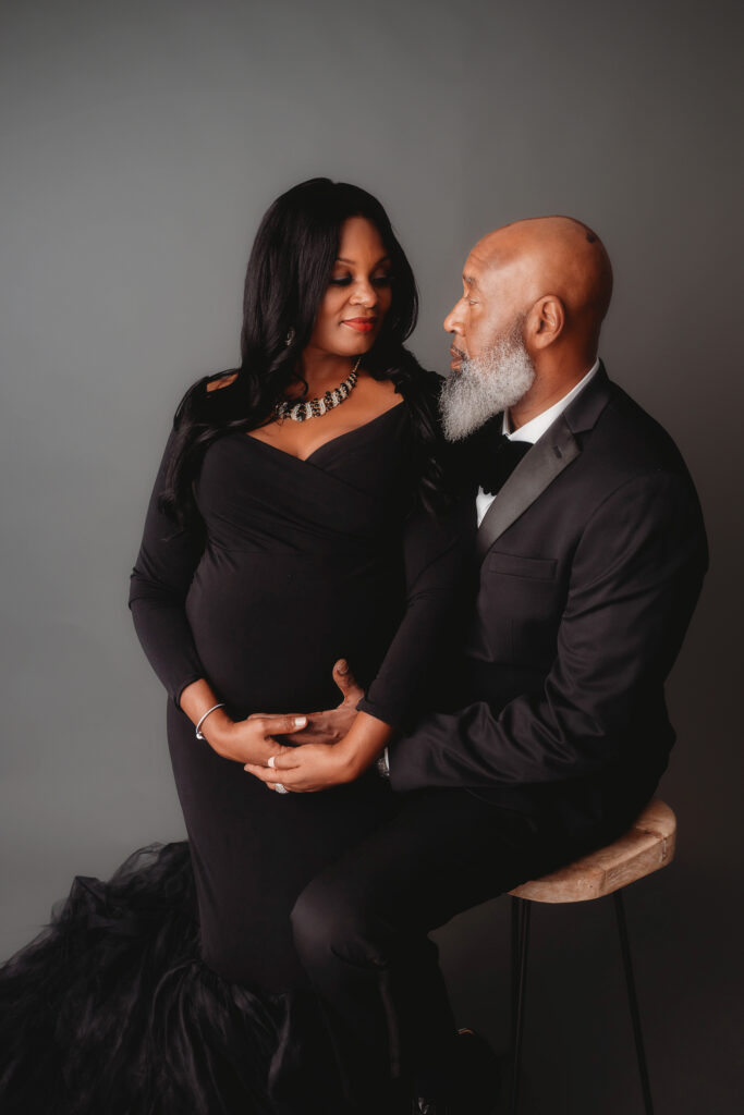 Expectant parents pose for Studio Maternity Portraits in Charleston, SC. 