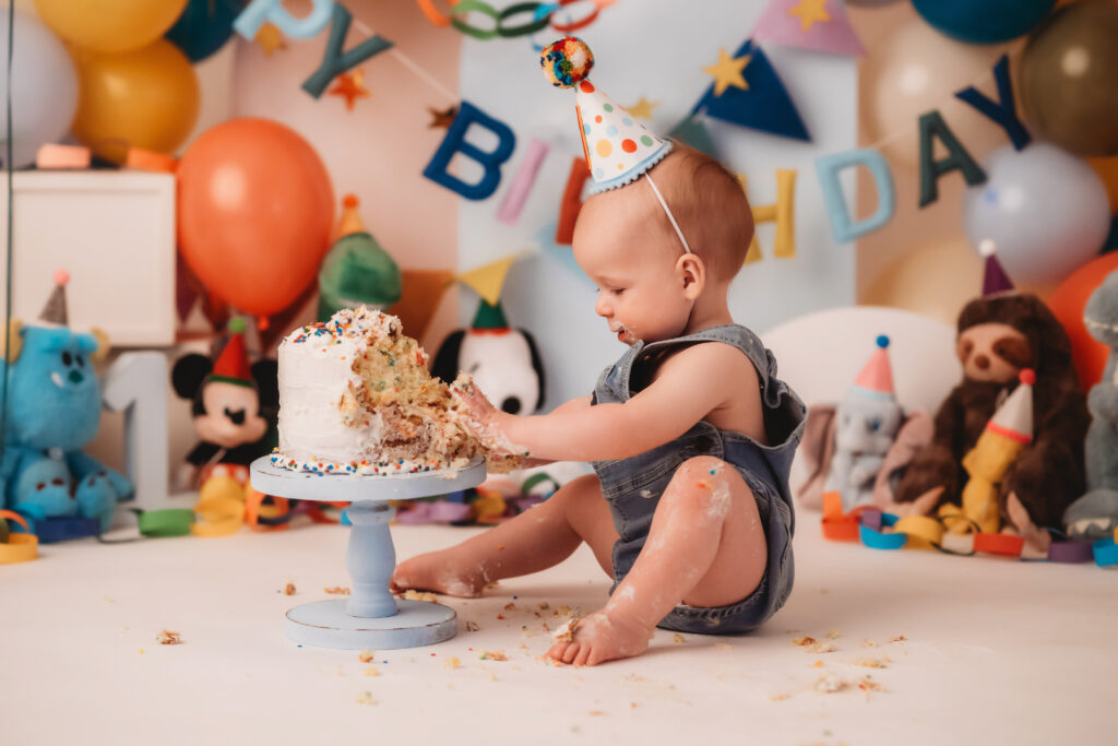 Baby plays in birthday cake during his Cake Smash Photoshoots in Charleston.