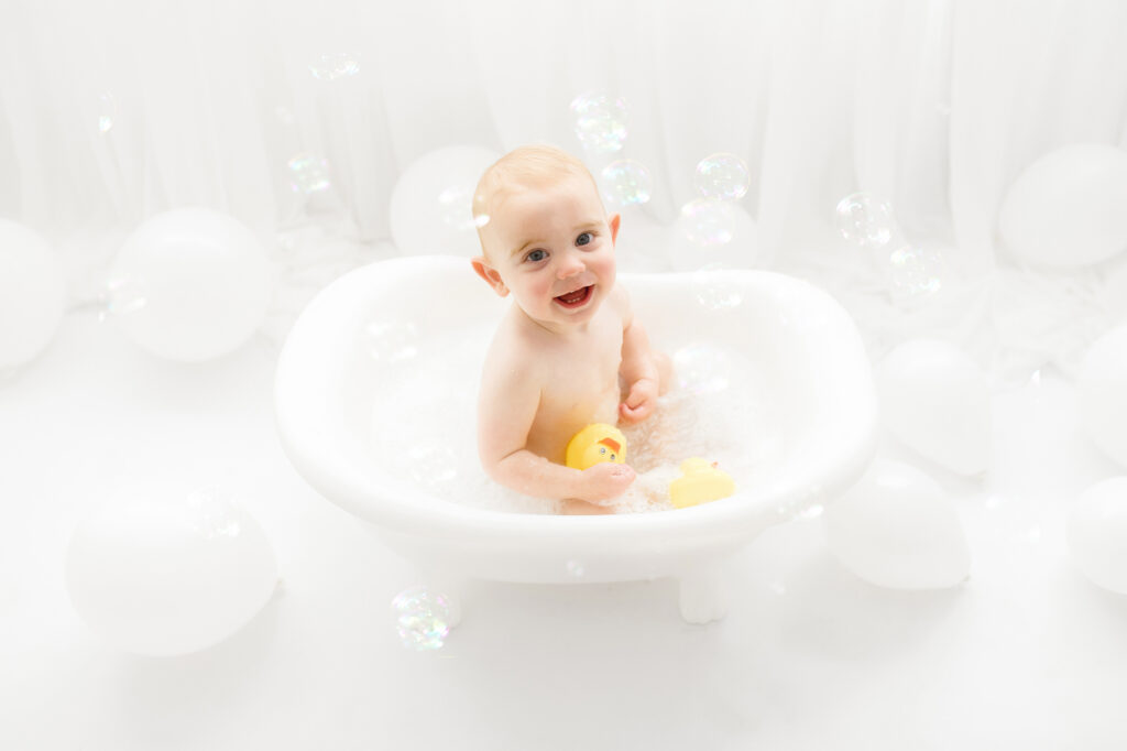 Baby sits for Birthday Cake Smash Photography in Charleston, SC Portrait Studio - Holy City Babies. 