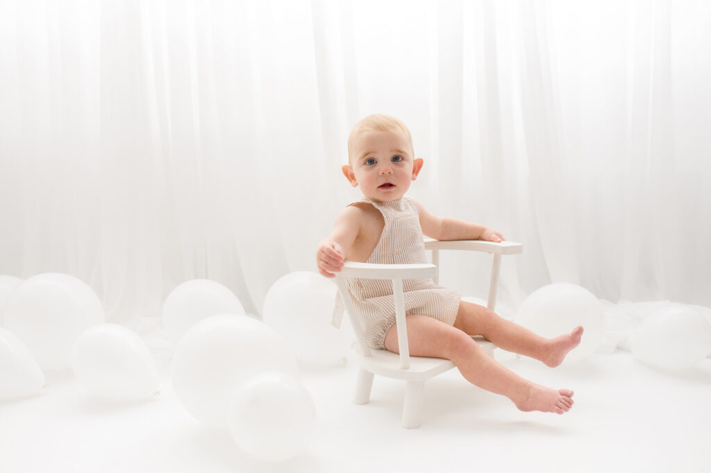 Baby sits for Birthday Cake Smash Photography in Charleston, SC Portrait Studio - Holy City Babies. 