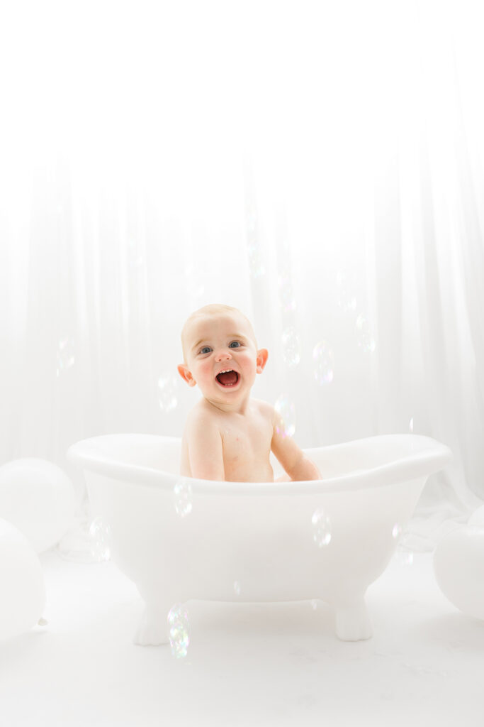 Baby sits for Birthday Cake Smash Photography in Charleston, SC Portrait Studio - Holy City Babies. 