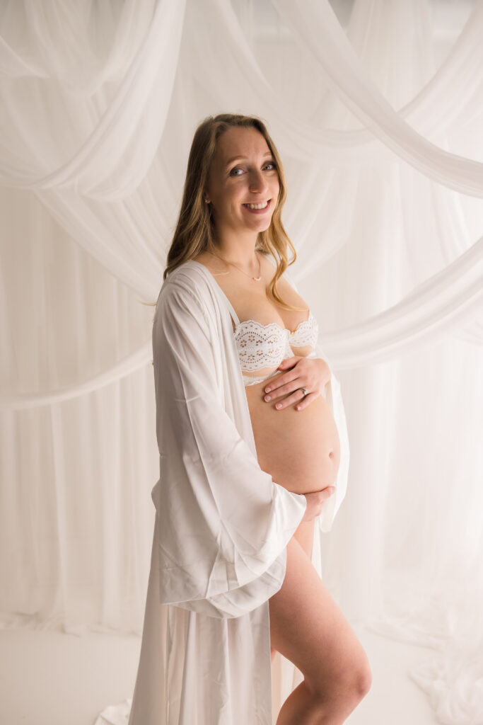 Expectant mother poses for Studio Maternity Portrait Session at Holy City Babies Portrait Studio in Charleston, SC.