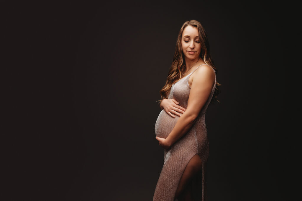 Expectant mother poses for Studio Maternity Portrait Session at Holy City Babies Portrait Studio in Charleston, SC.