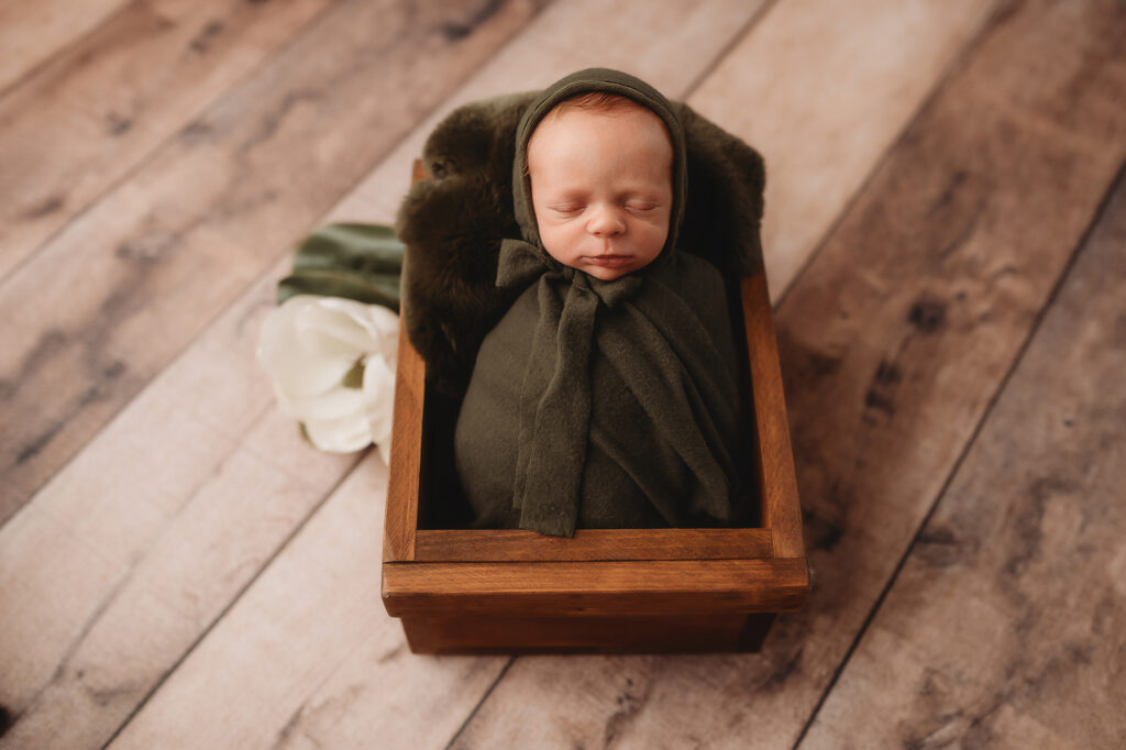 Baby posed for Luxury Newborn Photography in Charleston SC