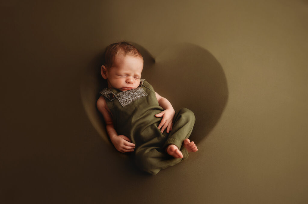 Infant posed for Newborn Portraits at Holy City Babies Newborn Photography studio in Charleston, SC. 