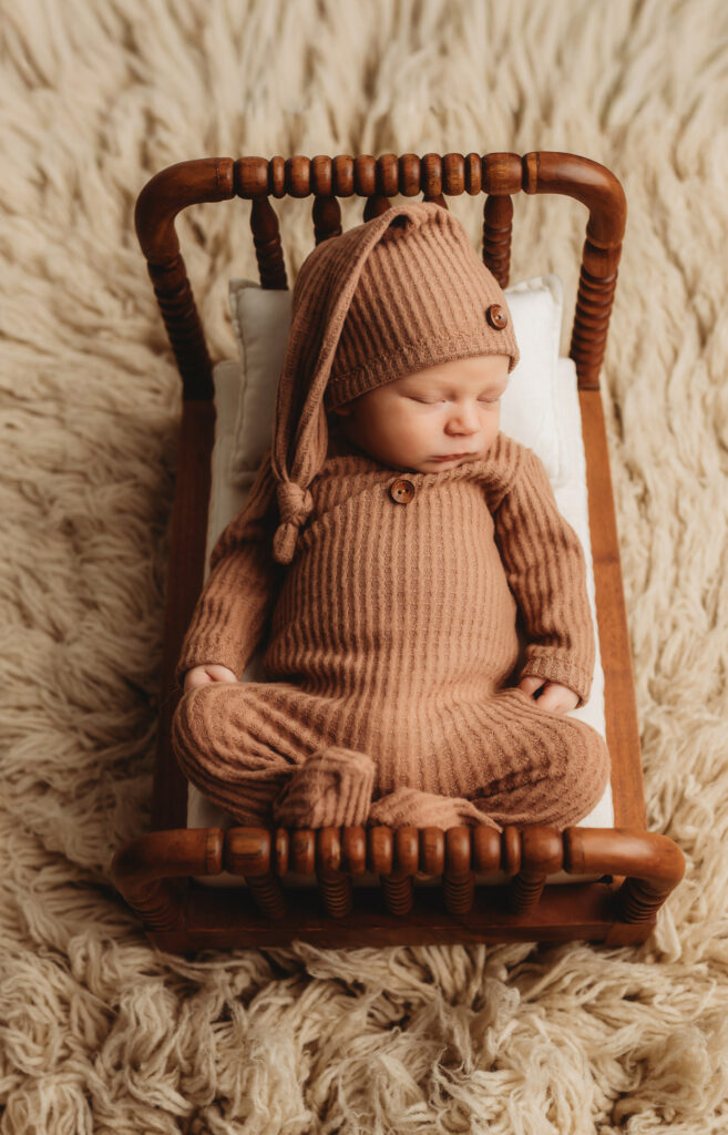 Infant posed for Fine Art, Newborn Portrait Session at Full-Service Newborn Photography Studio in Charleston, SC.