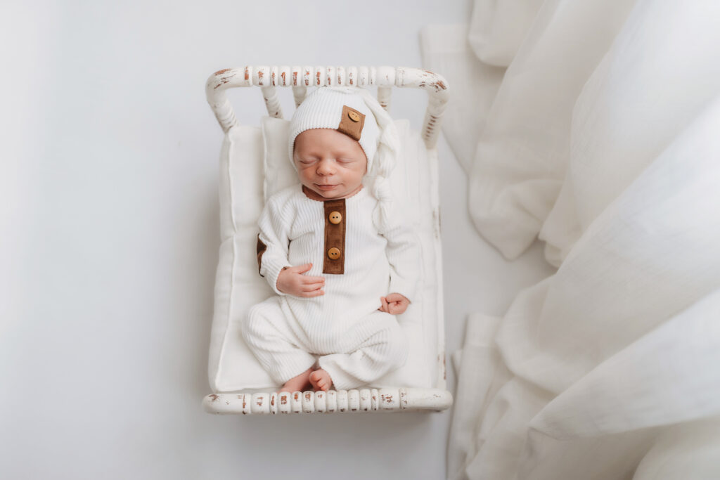 Newborn Baby posed for Newborn Portrait Session at Holy City Babies Portrait Studio in Charleston, SC. 