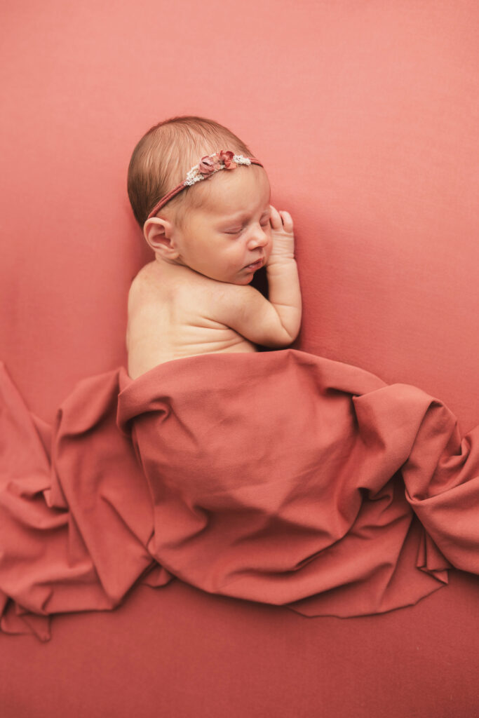 Newborn posed for Newborn Portraits at Holy City Babies Portrait Studio in Charleston, SC as photographer details Best Labor & Delivery Hospitals in Charleston SC.