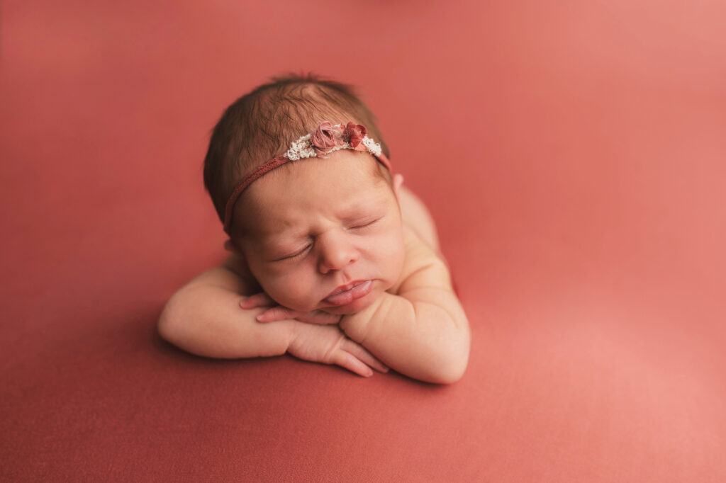 Newborn posed for Newborn Portraits at Holy City Babies Portrait Studio in Charleston, SC as photographer details Best Labor & Delivery Hospitals in Charleston SC.