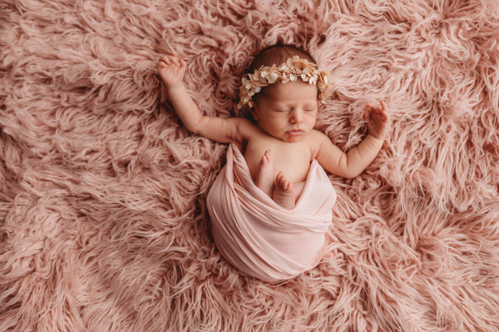 Newborn posed for Newborn Portraits at Holy City Babies Portrait Studio in Charleston, SC.