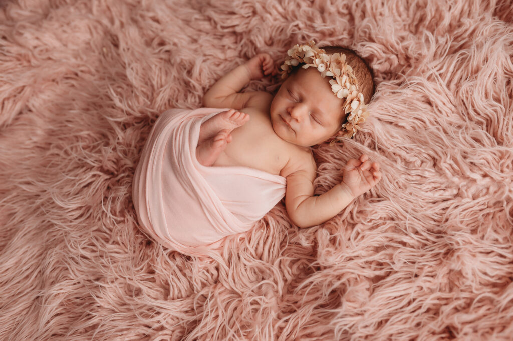 Newborn posed for Newborn Portraits at Holy City Babies Portrait Studio in Charleston, SC as photographer details Best Labor & Delivery Hospitals in Charleston SC.