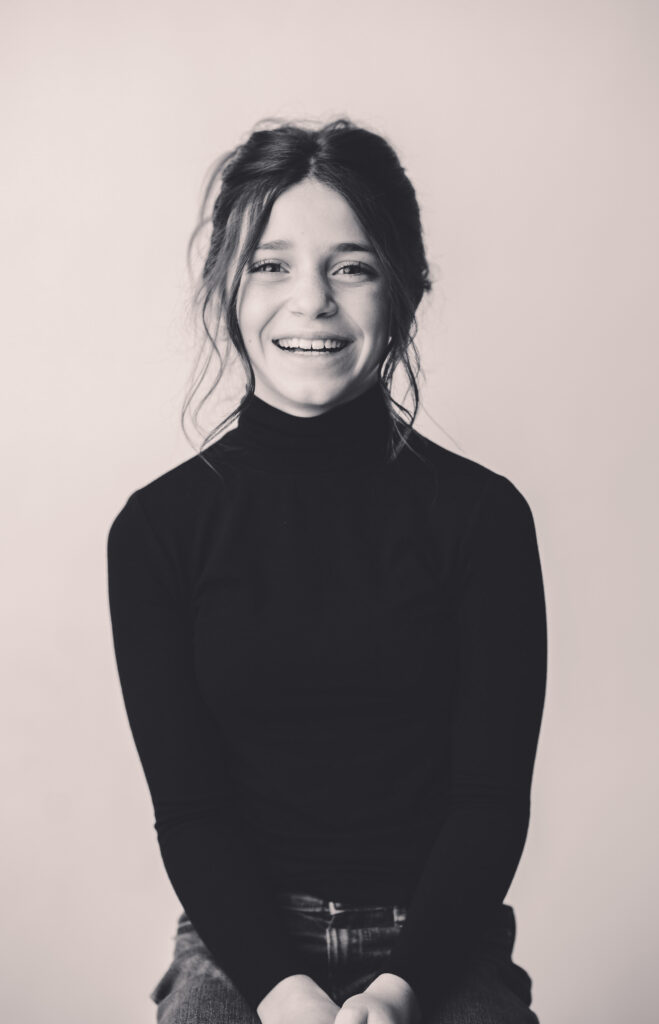 Young girl sits for Personality Portraits in Charleston at Holy City Babies Portrait Studio. 