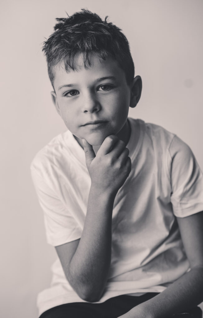 Little boy sits for Personality Portraits in Charleston at Holy City Babies Portrait Studio. 