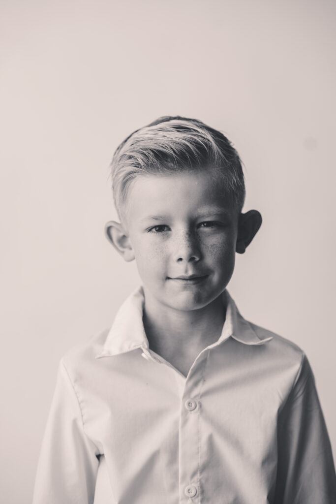 Little boy sits for Personality Portraits in Charleston at Holy City Babies Portrait Studio.