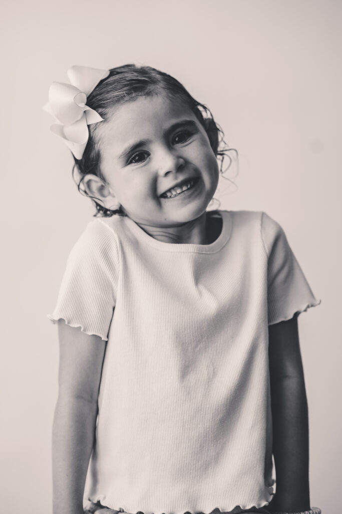 Little girl sits for Personality Portraits in Charleston at Holy City Babies Portrait Studio.