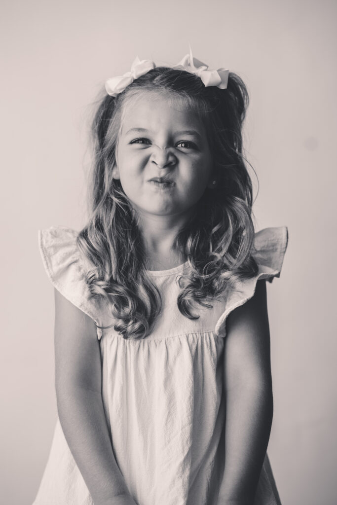 Little girl sits for Personality Portraits in Charleston at Holy City Babies Portrait Studio.