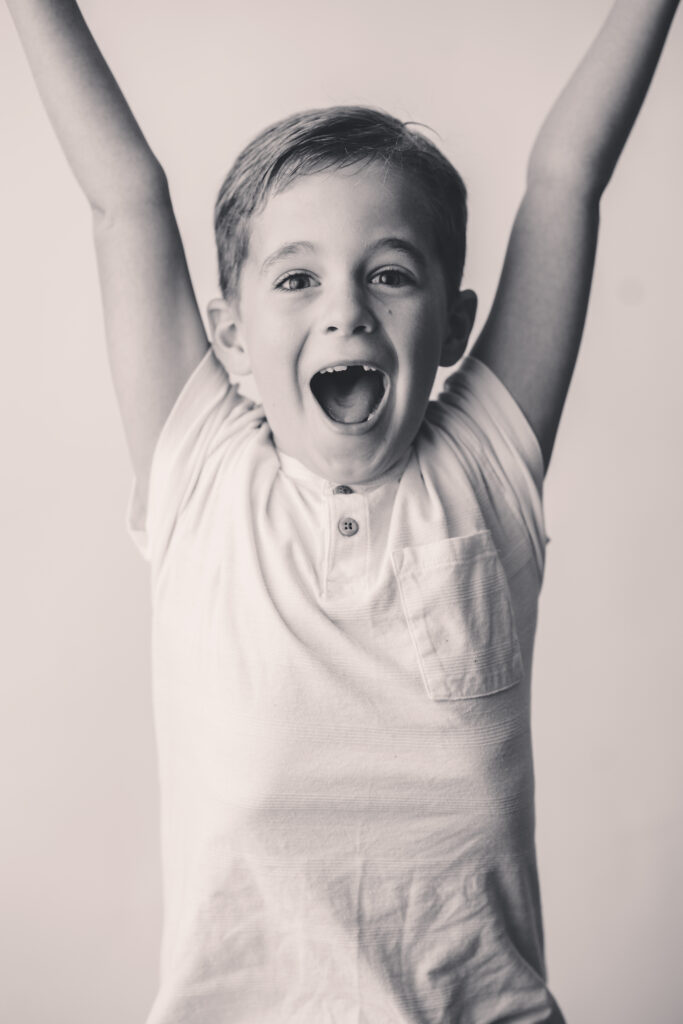 Little boy sits for Personality Portraits in Charleston at Holy City Babies Portrait Studio.