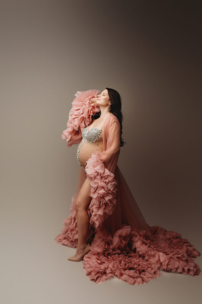 Pregnant mother poses for Maternity Photoshoot in Charleston after answering the question: What Does a Maternity Photoshoot Cost in Charleston?