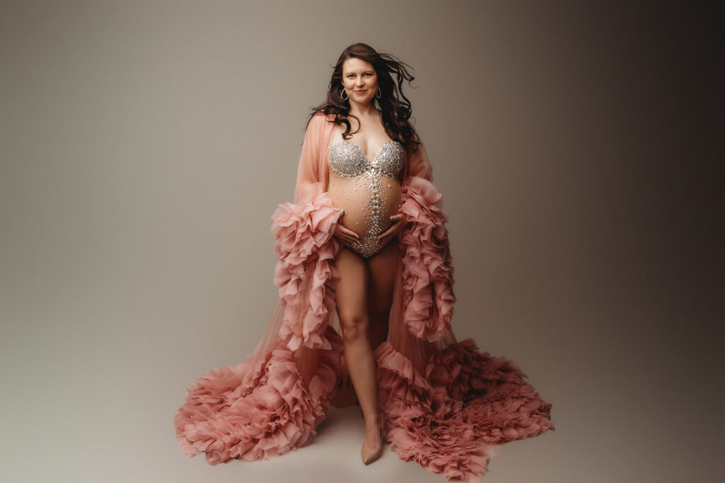 Pregnant mother poses for Maternity Photoshoot in Charleston after answering the question: What Does a Maternity Photoshoot Cost in Charleston?