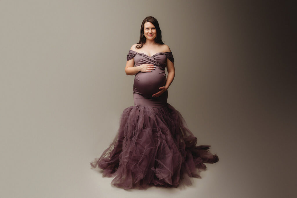 Pregnant mother poses for Maternity Photoshoot in Charleston after answering the question: What Does a Maternity Photoshoot Cost in Charleston?