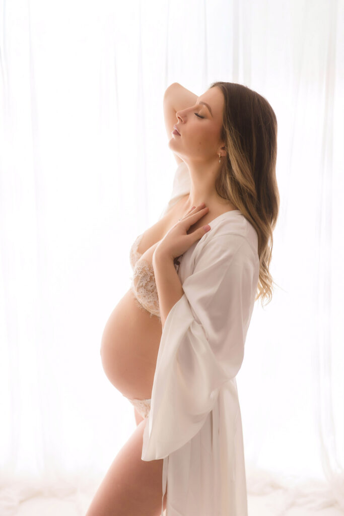 Pregnant mother poses for Studio Maternity Photoshoot at Holy City Babies Portrait Studio in Charleston, SC.