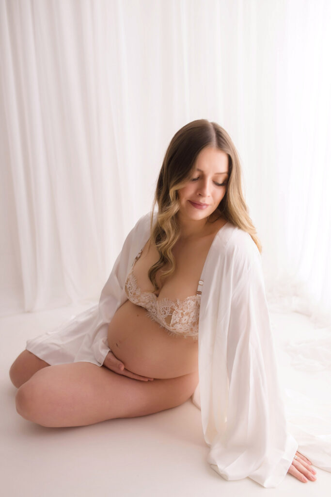 Pregnant mother poses for Studio Maternity Photoshoot at Holy City Babies Portrait Studio in Charleston, SC.