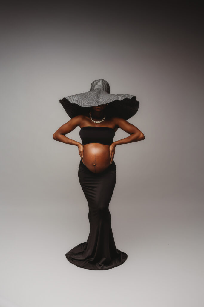 Pregnant woman poses for Maternity Portrait Session at Holy City Babies Maternity Portrait Studio in Charleston, SC after considering What to Wear for Maternity Photos in Charleston.