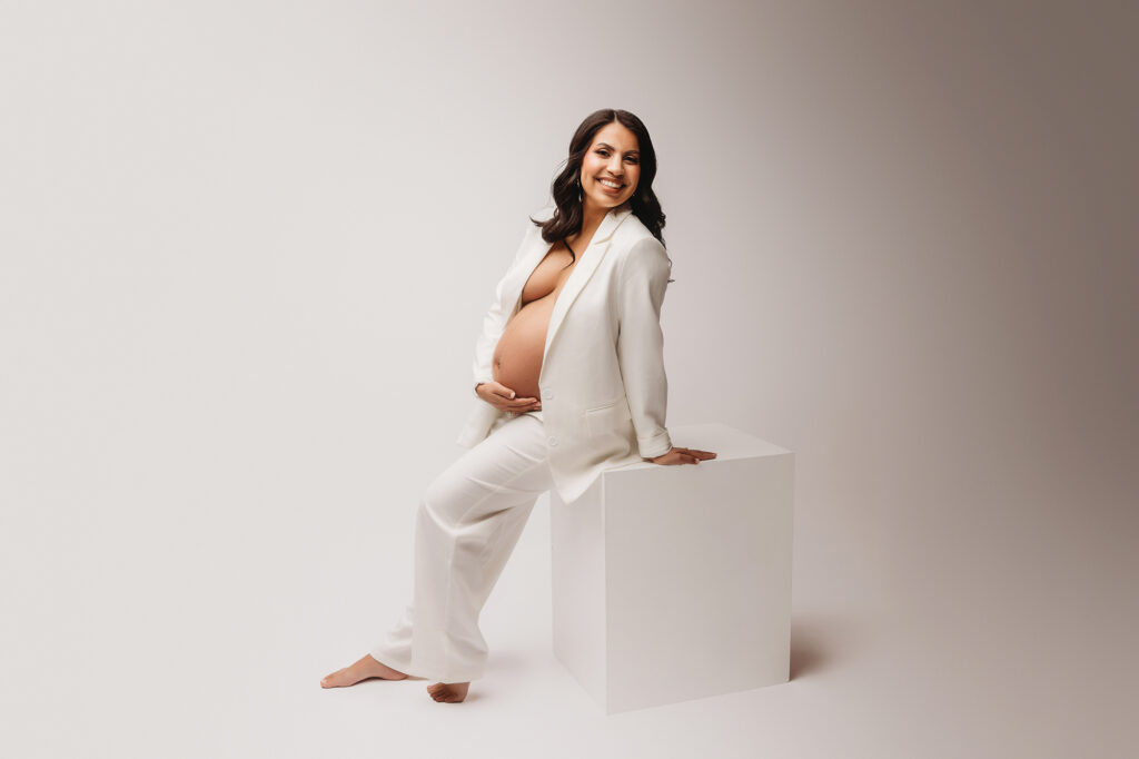 Pregnant woman poses for Maternity Portrait Session at Holy City Babies Maternity Portrait Studio in Charleston, SC after considering What to Wear for Maternity Photos in Charleston.