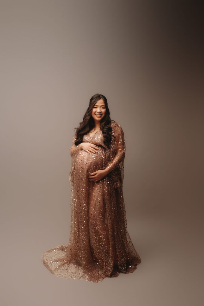 Pregnant woman poses for Maternity Portrait Session at Holy City Babies Maternity Portrait Studio in Charleston, SC after considering What to Wear for Maternity Photos in Charleston.