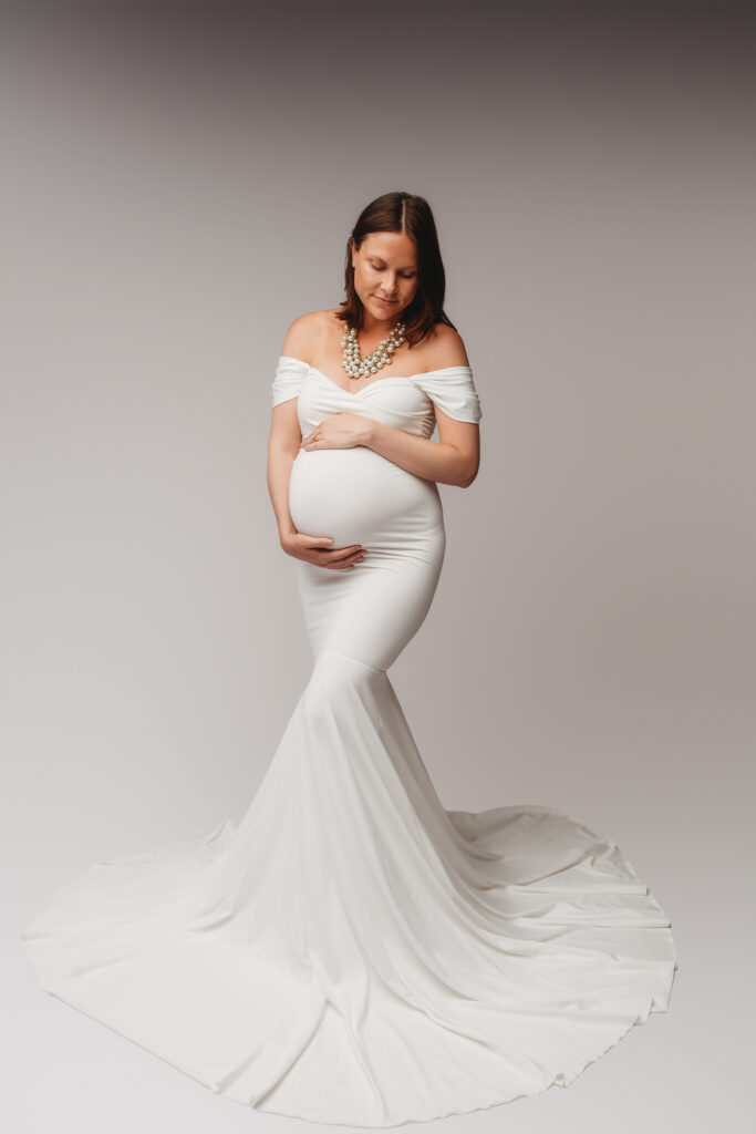 Expectant mother poses for Studio Maternity Portraits at Holy City Babies Portrait Studio in Charleston, SC after learning When to Schedule Maternity Photos in Charleston.