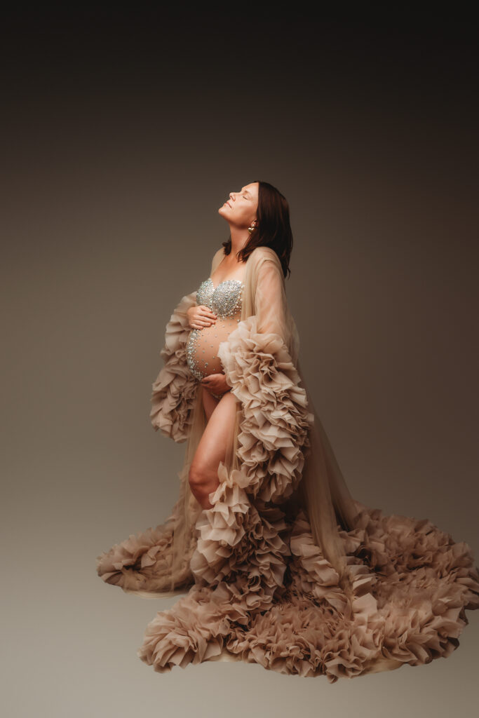 Expectant mother poses for Fine Art Studio Maternity Portraits at Holy City Babies Portrait Studio in Charleston, SC.