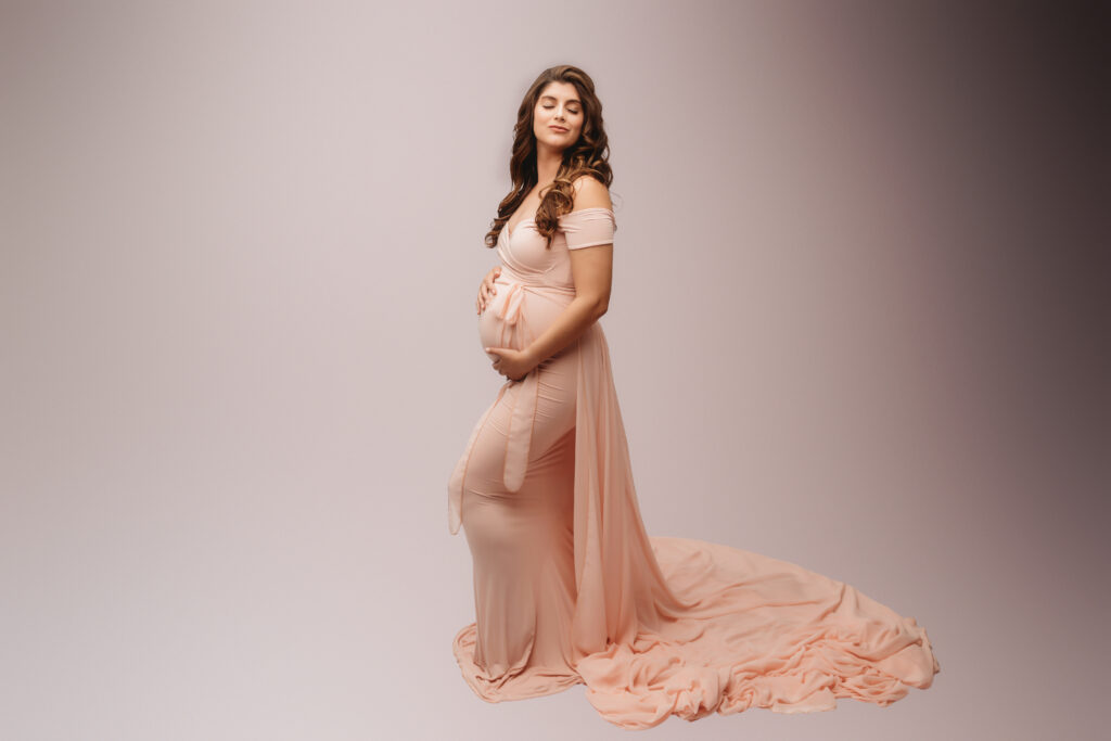 Pregnant mother poses for Studio Maternity Portraits at Holy City Babies Portrait Studio in Charleston, SC. 
