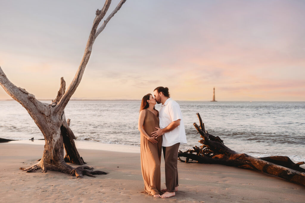Expectant Parents pose for Maternity Photos on Folly beach in Charleston, SC.