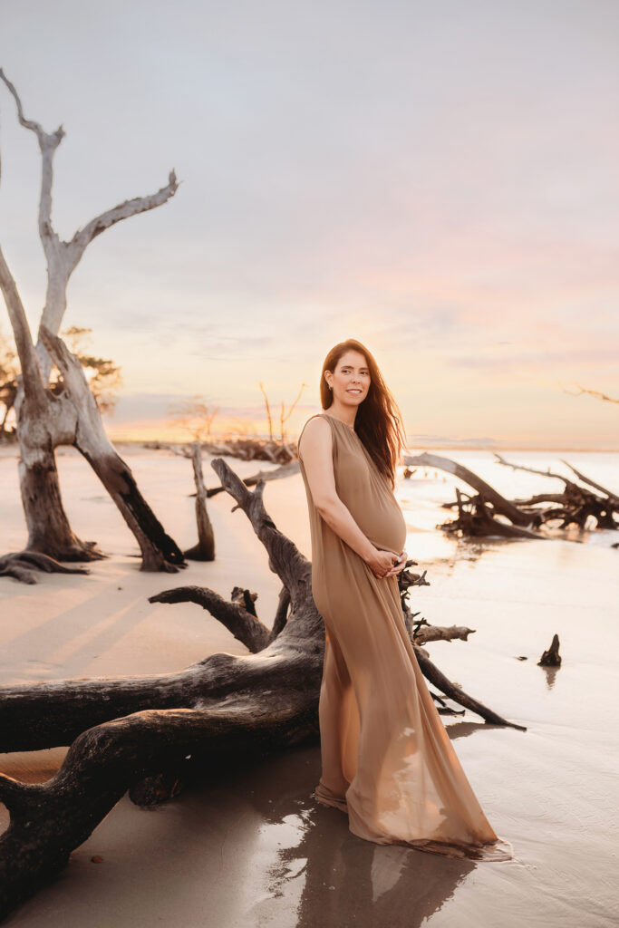 Expectant Mother poses for Maternity Photos on Folly beach in Charleston, SC.