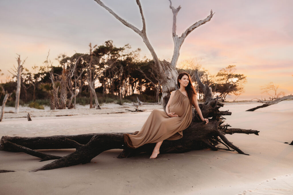 Expectant Mother poses for Maternity Photos on Folly beach in Charleston, SC.