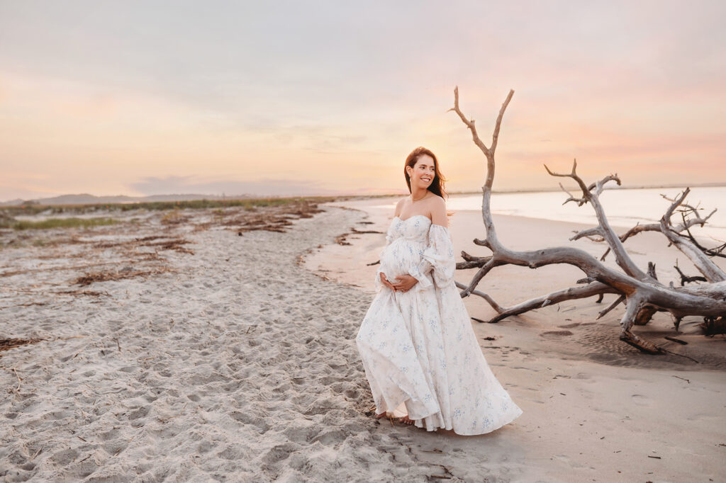 Pregnant woman poses for Maternity Portraits on Folly Beach in Charleston, SC after receiving Tips for Planning Beautiful Maternity Portraits on Folly Beach from Charleston's Leading Maternity Photographer, Brittany Sisk of Holy City Babies Portrait Studio.