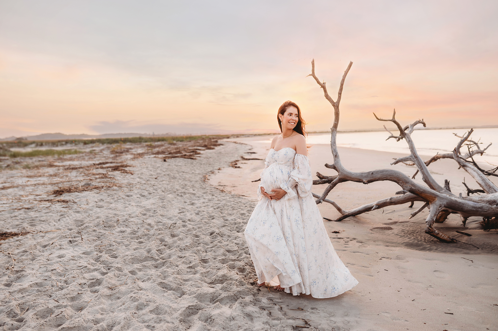 Expectant mother poses for Maternity Portraits on Folly Beach in Charleston, SC.