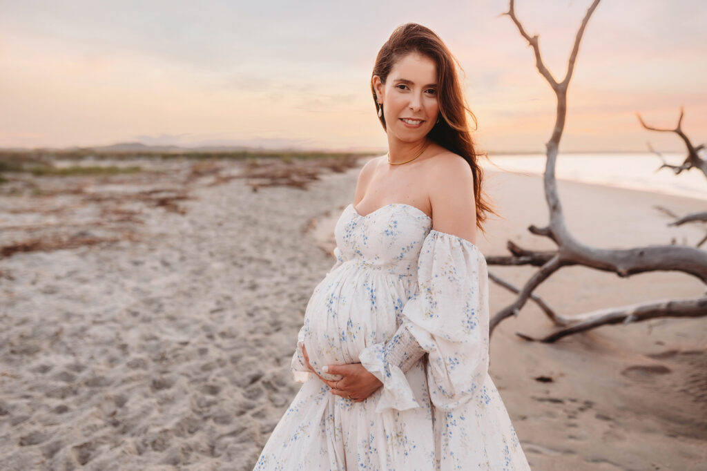 Pregnant woman poses for Maternity Portraits on Folly Beach in Charleston, SC after receiving Tips for Planning Beautiful Maternity Portraits on Folly Beach from Charleston's Leading Maternity Photographer, Brittany Sisk of Holy City Babies Portrait Studio.