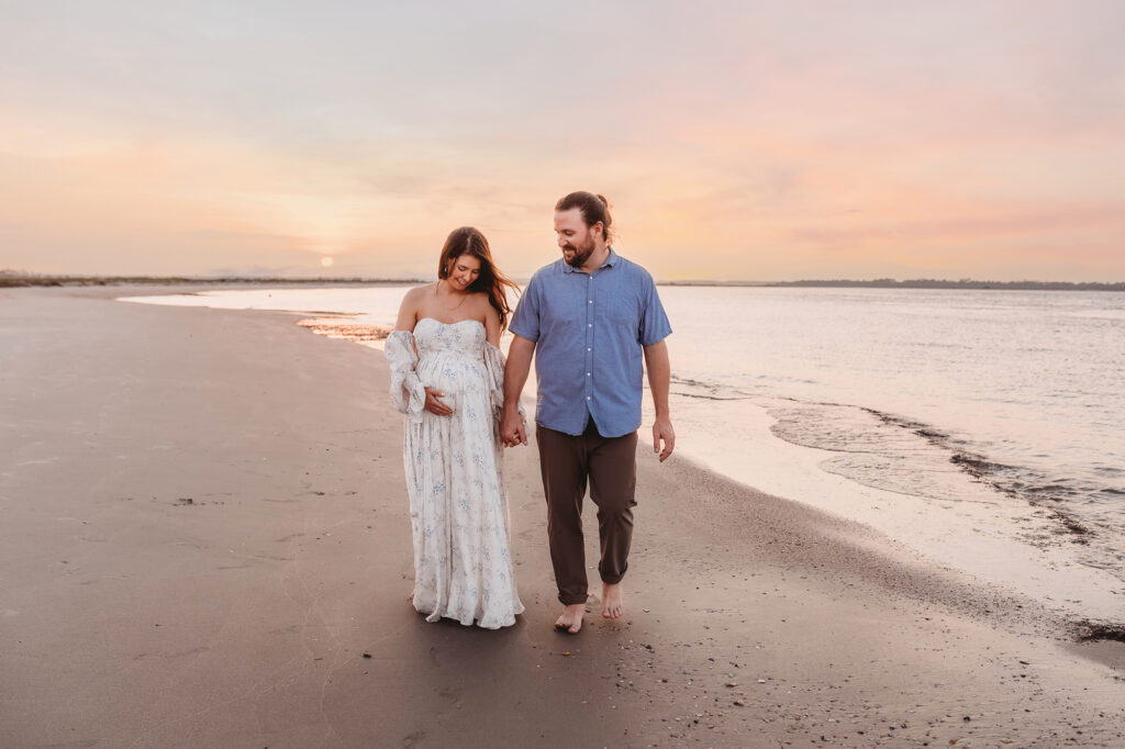 Expectant Parents pose for Maternity Portraits on Folly Beach in Charleston, SC after receiving Tips for Planning Beautiful Maternity Portraits on Folly Beach from Charleston's Leading Maternity Photographer, Brittany Sisk of Holy City Babies Portrait Studio.